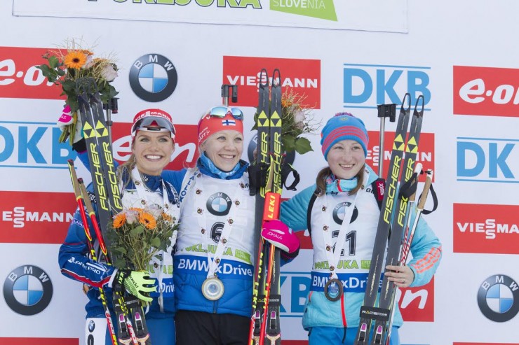 The women's IBU World Cup mass start podium in Pokljuka, Slovenia: with Finland's winner Kaisa Mäkäräinen (c), runner-up Gabriela Soukalova (l) of the Czech Republic, and Russia's Olga Podchufarova (r) in third. (Photo: Fischer/NordicFocus)