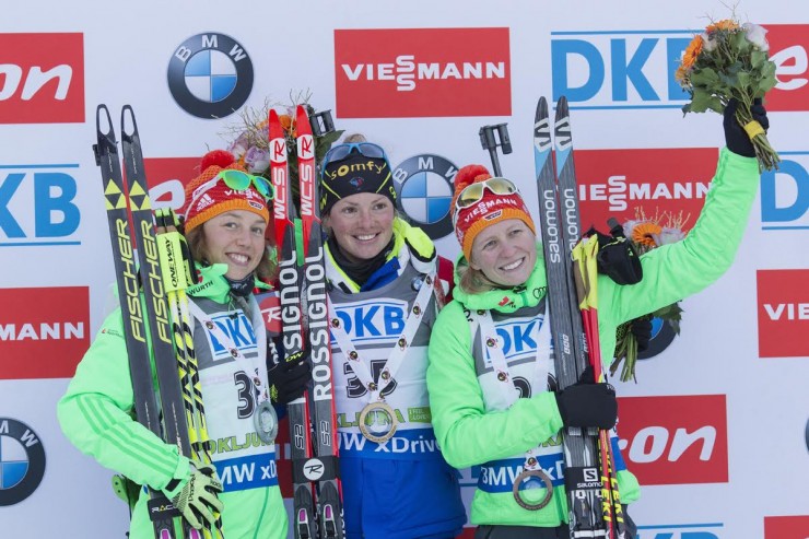 The women's 7.5 k sprint podium on Friday at the IBU World Cup in Pokljuka, Slovenia, with winner Marie Dorin Habert of France (c), and two Germans: Laura Dahlmeier (l) in second and Franziska Hildebrand (r) in third. (Photo: Fischer/NordicFocus)
