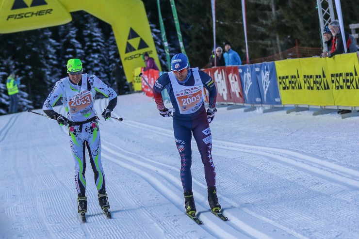American Andy Newell (l) outsprints Italy's Mauro Brigadoi, for second place in the Dolomitenlauf, 42 k classic race on Saturday in Lienz, Austria. (Photo: Fischer/NordicFocus) 