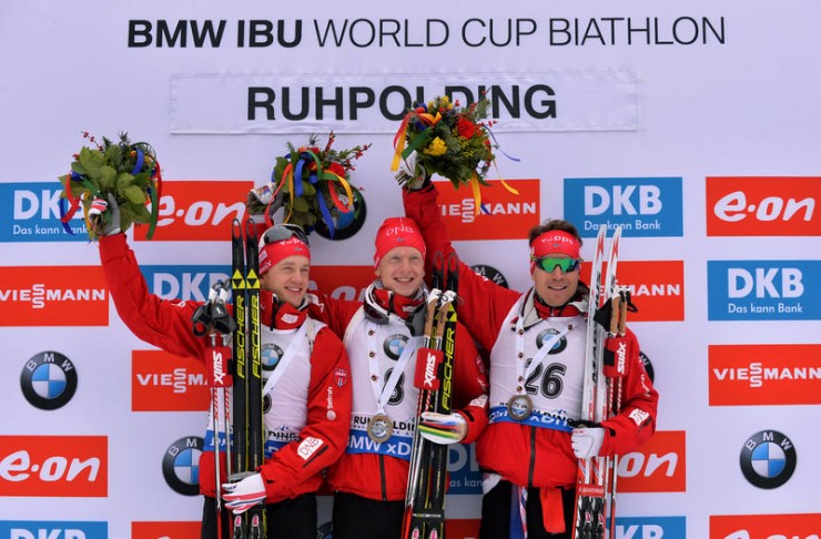 The all-Norwegian podium in the men's 10 k sprint on Friday at the IBU World Cup in Ruhpolding, Germany: with winner Johannes Thingnes Bø (c), brother Tarjei Bø (l) in second, and Emil Hegle Svendsen (r) in third. (Photo: IBU/Eberhard Thonfeld)