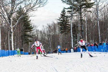 Jennie Bender (BSF) (r) and Anne Hart (SMST2) lunge for the line in the women's 1.5 k freestyle sprint on Monday at U.S. nationals  in Houghton, Mich