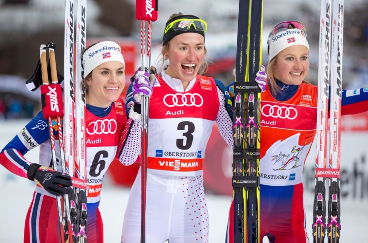 Sophie Caldwell (c) after becoming the first U.S. woman to win a World Cup classic sprint with the other podium finishers, Norway's Heidi Weng (l) in second and Ingvild Flugstad Østberg (r) in third in the 1.2 k classic sprint at Stage 4 of the Tour de Ski in Oberstdorf, Germany. (Photo: Marcel Hilger)