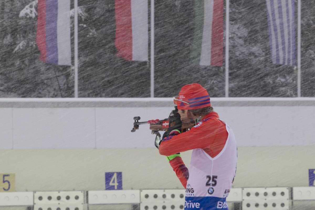 Lowell Bailey shooting through the snowstorm in Ruhpolding, Germany, on his way to 14th place in the 20 k individual. (Photo: U.S. Biathlon/NordicFocus.) 