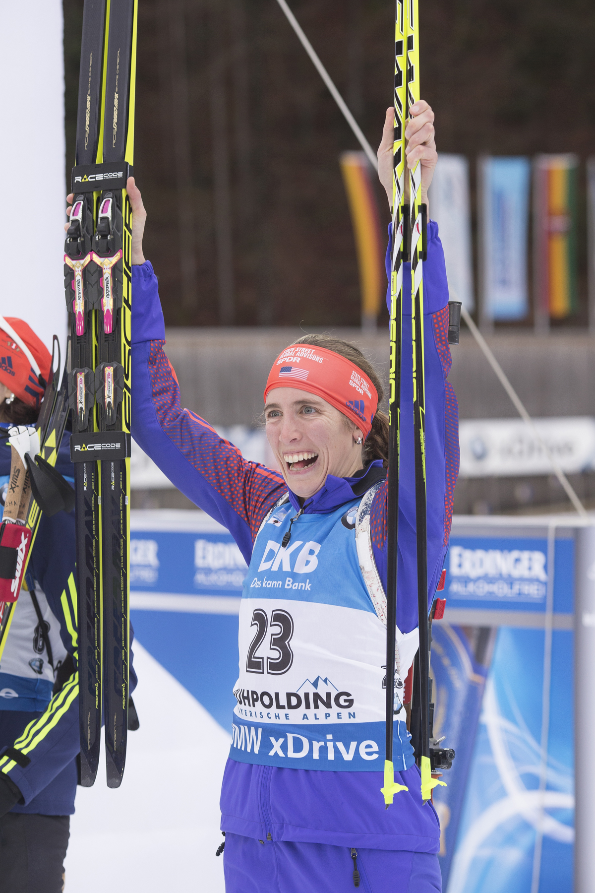 Susan Dunklee (US Biathlon) at the flower ceremony for last Sunday's mass start in Ruhpolding, where she finished sixth. This time around it was 22nd. " I'll be looking to find that good feeling on the range again like I had last week.  It's there, I know it is," she wrote. (Photo: Fischer/NordicFocus)