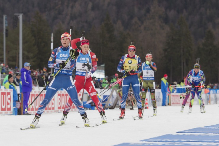 From left to right: Veronika Vitkova of the Czech Republic, Norway's Tiril Eckhoff, and Czech Gabriela Soukalova prepare to shoot during one of two standing stages in the women's mass start on Sunday in Ruhpolding, Germany. (Photo: Fischer/NordicFocus)