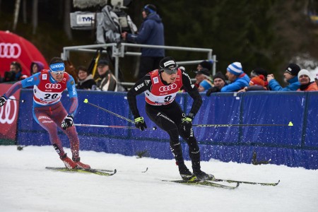 Maxim Vylegzhanin (RUS), and Dario Cologna (SUI) carve through the challenging conditions in Oberstdorf (GER).  (photo: Fischer/Nordic Focus)