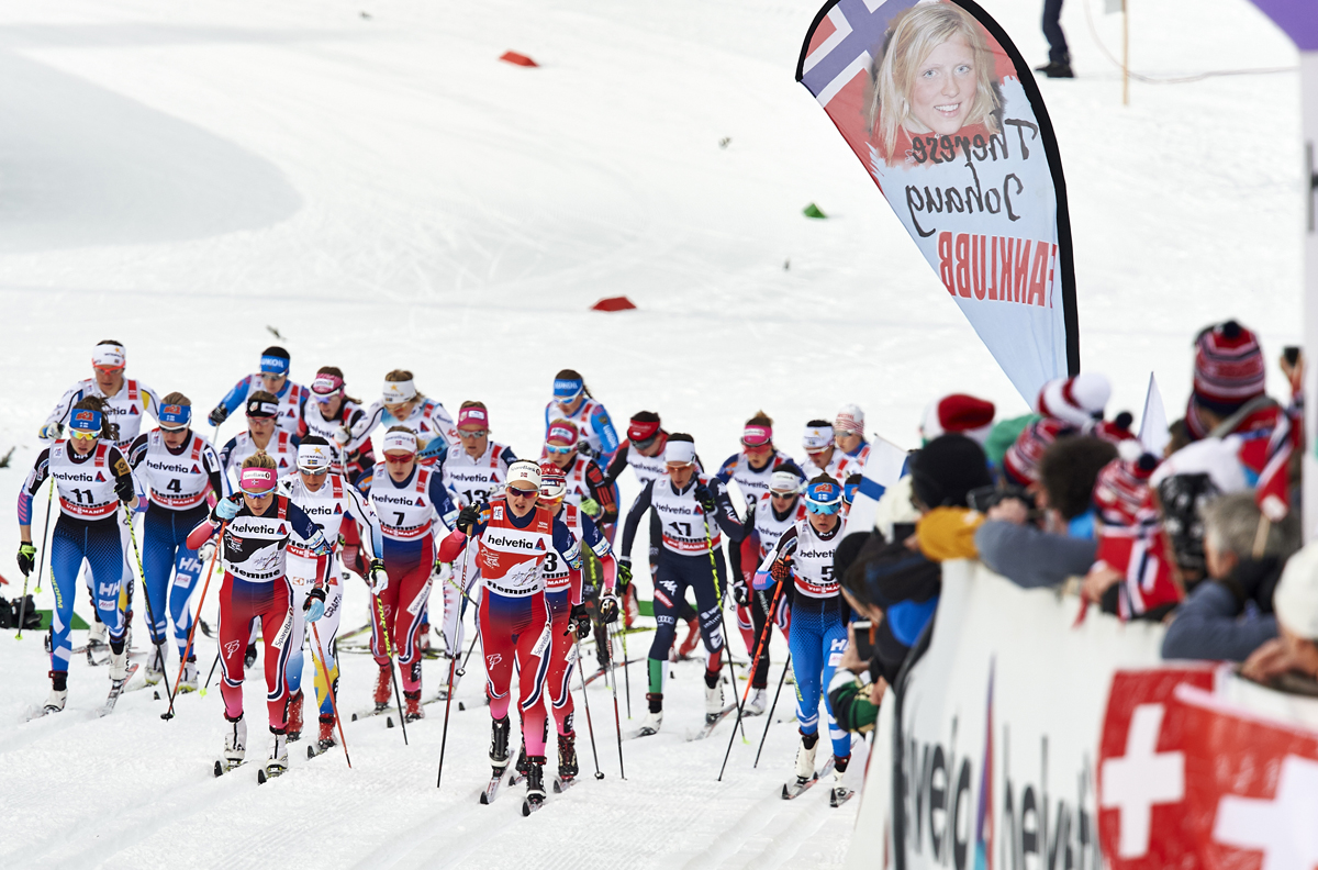 Therese Johaug (NOR) and Ingvild Flugstad Oestberg (NOR) lead the women's mass start out of the stadium in Val di Fiemme (ITA). 43 women and 55 men competed that day, making the women's field less than 80% of the size of the men's field. (photo: Fischer/Nordic Focus)