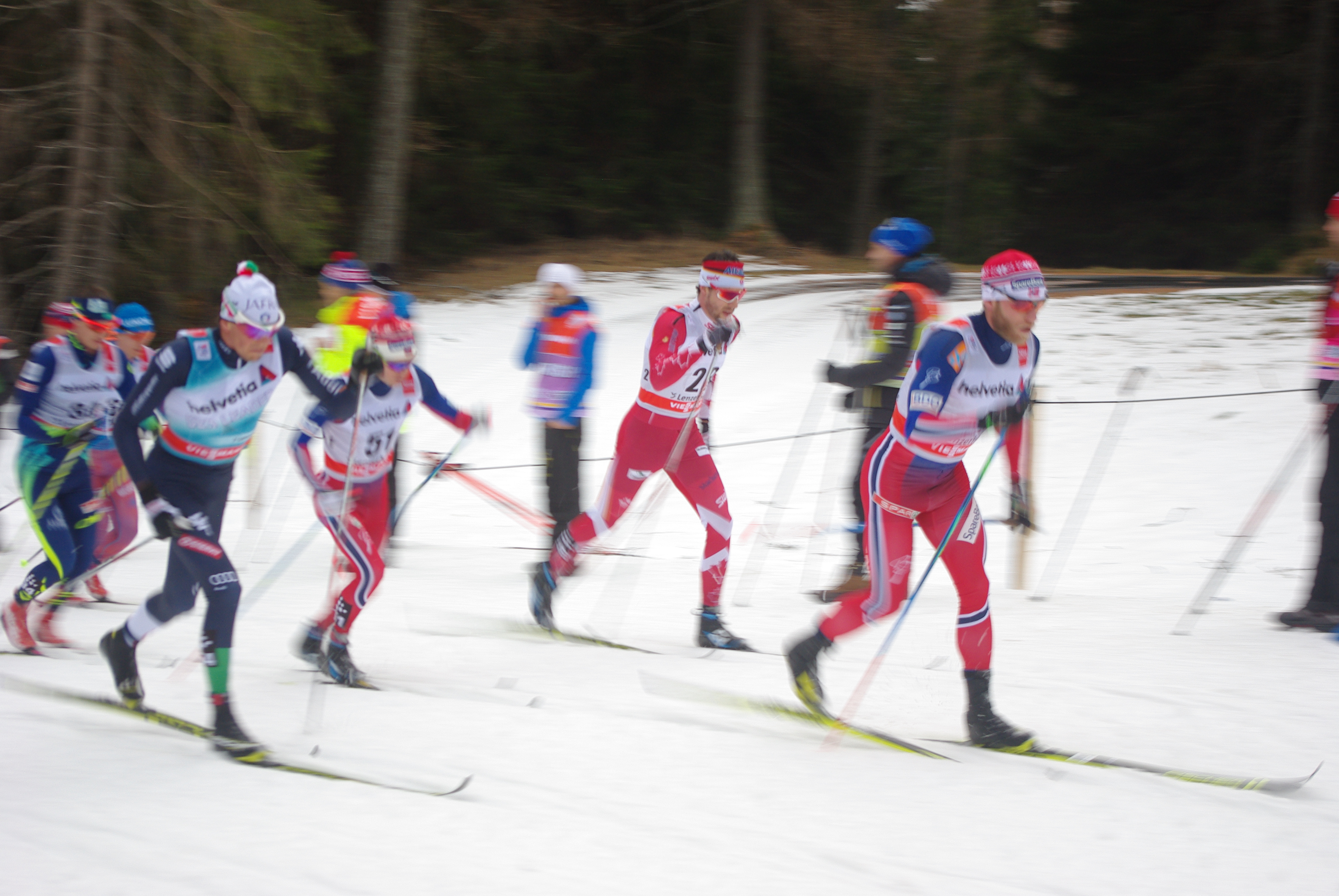 Alex Harvey of Canada (second from right) in the pack with Martin Johnsrud Sundby of Norway in the middle of the 30 k.