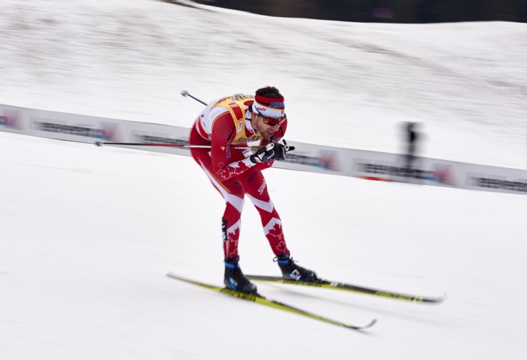 Alex Harvey (Canadian World Cup Team) racing to seventh in the 15 k classic mass start at Stage 7 of the Tour de Ski in Val di Fiemme, Italy. He's currently 12th heading into the final climb. (Photo: Fischer/NordicFocus) 
