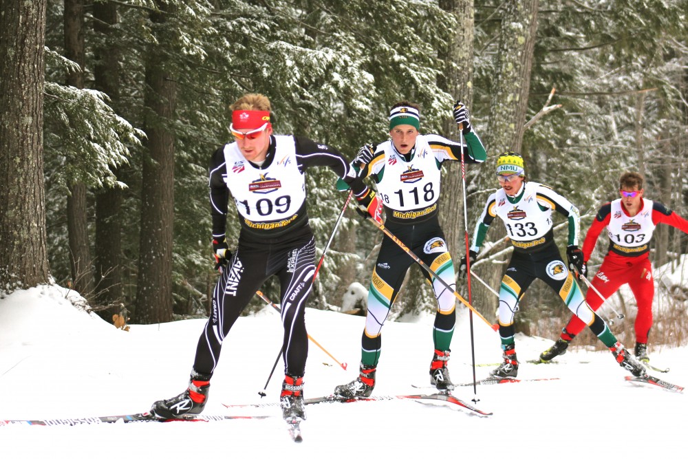 Racers (left to right) Kyle Bratrud of CXC and Northern Michigan University's Adam Martin and Jake Brown, along with Team Freebird's Kris Freeman, chasing a break away group of Brian Gregg (Team Gregg/Madshus) (not shown), Tad Elliot (Ski and Snowboard Club Vail) (not shown), and Kevin Sandau (AWCA) (not shown) half-way throught the second lap of the men's 20 k freestyle mass start race on Thursday at U.S. nationals in Houghton, Mich. Bratrud went on to place tenth overall, Martin fourth, Brown sixth, and Freeman ninth. 