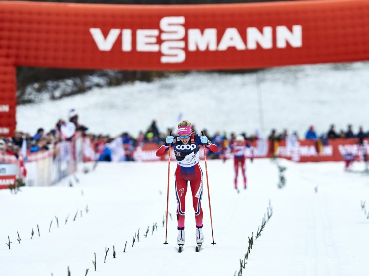 Therese Johaug double poles to the clear-cut win, beating Norwegian teammate Ingvild Flugstad Østberg by 9.9 seconds, in Stage 5 of the Tour de Ski: the 10 k classic mass start in Oberstdorf, Germany. (Photo: Fischer/NordicFocus)