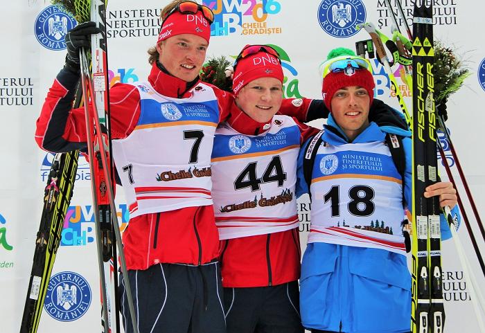The youth men's 15 k individual podium at 2016 IBU Youth World Championships in Cheile Gradistei, Romania, with Norwegian winner Harald Øygard (c), Aleksander Fjeld Andersen (l) of Norway in second, and Italy's Michael Durand (r) in third. (Photo: Norges Skiskytter Forbund)