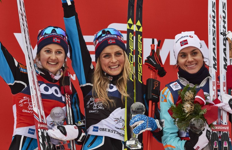 The women's 10 k classic mass start podium at Stage 5 of the Tour de Ski in Oberstdorf, Germany, with three Norwegians: (from left to right) runner-up Ingvild Flugstad Østberg (still the overall Tour leader), winner Therese Johaug, and Heidi Weng in third. (Photo: Fischer/NordicFocus