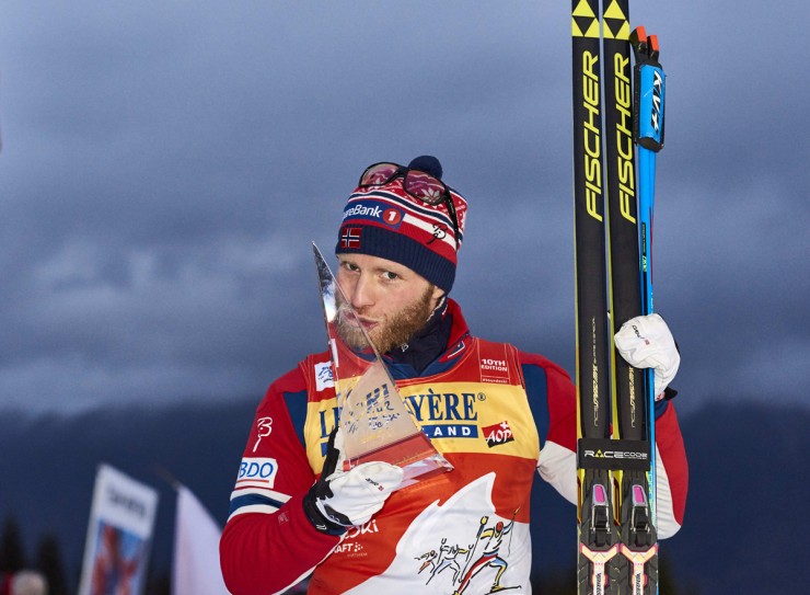 Martin Johnsrud Sundby of Norway celebrates the fruits of his labor over eight stages of the Tour de Ski (TdS), after winning the final climb on Sunday for his third-consecutive TdS title in Val di Fiemme, Italy. (Photo: Fischer/NordicFocus)  