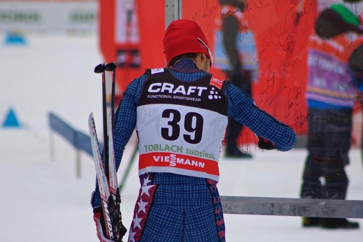 Noah Hoffman (U.S. Ski Team) signing his name before the 10 k freestyle at Stage 6 of the Tour de Ski in Toblach, Italy, where he placed 19th for his best result this season. (Photo: JoJo Baldus)