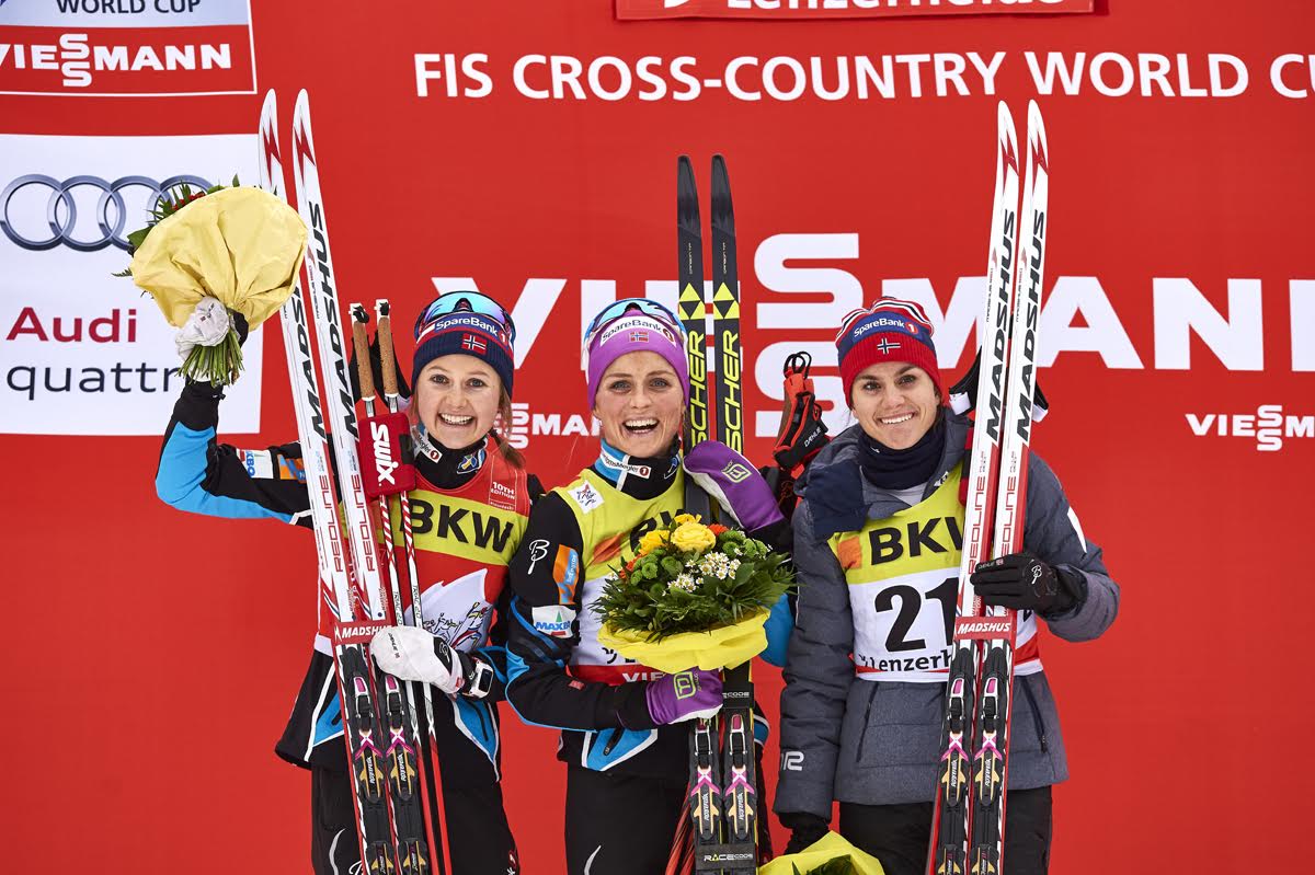 The Norwegian women swept the 15 k classic mass start podium at Stage 2 of the Tour de Ski on Saturday in Lenzerheide, Switzerland, with winner Therese Johaug (c), Ingvild Flugstad Østberg (l) in second, and Heidi Weng in third. (Photo: Fischer/NordicFocus)