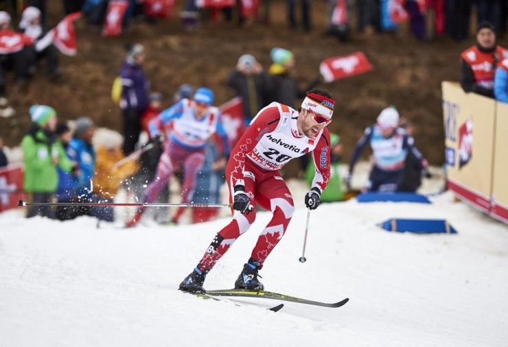 Canada's Alex Harvey racing to seventh in Saturday's Stage 2 of the Tour de Ski, the 15 k classic mass start. He went on to place ninth in the 10 k freestyle pursuit on Sunday in Lenzerheide, Switzerland, to rank ninth in the Tour after three of eight stages. (Photo: Fischer/NordicFocus)