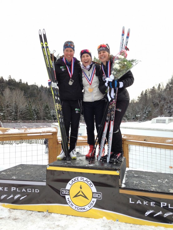 Middlebury senior Kelsey Phinney (c) takes her first SuperTour win at the Lake Placid freestyle sprint on Jan. 30, followed by Craftsbury's Caitlin Patterson (l) in second and Stratton's Anne Hart (r) in third. (Photo: Heidi and Bob Underwood)