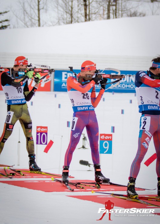 American Tim Burke (c) shooting with Russia's Anton Shipulin (r) and Germany's Arnd Peiffer (l) during the men's 15 k mass start on Saturday at the IBU World Cup in Canmore, Alberta. Burke went on to place a season-best seventh. (Photo: Daniel S. Guay)
