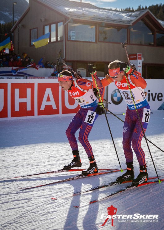 Tim Burke (l) after tagging teammate Lowell Bailey in fourth, about 36 seconds behind Norway in third, during the mixed relay at the IBU World Cup in Canmore, Alberta. (Photo: Daniel S. Guay)