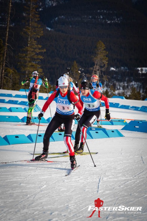 Canada's Nathan Smith (behind) coming through the exchange zone to tag teammate Julia Ransom during single mixed relay at the IBU World Cup in Canmore, Alberta. (Photo: Daniel S. Guay) 
