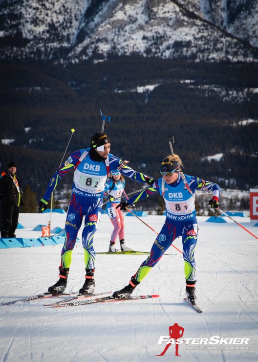 France's Martin Fourcade (l) tags teammate Marie Dorin  Habert for her the third of four legs in the single mixed relay at the IBU World Cup in Canmore, Alberta. They ended up winning by 45 seconds. (Photo: Daniel S. Guay)