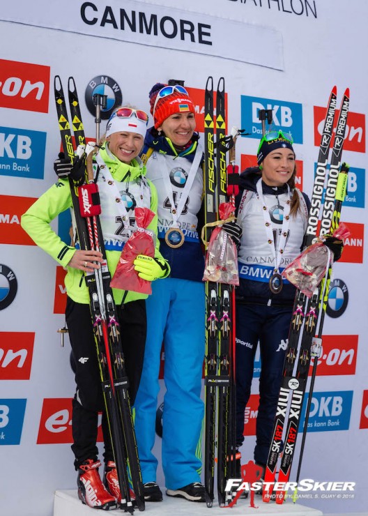 The women's sprint podium at the IBU World Cup in Canmore, Alberta: with winner Olena Pidhrushna (c) of Ukraine,  Poland's Krystyna Guzik (l) in second and Italy's Dorothea Wierer (r) in third. (Photo: Daniel S. Guay)