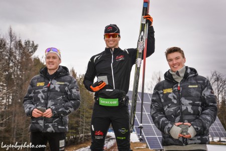 Left to right: Cole Morgan (UVM), Kris Freeman (Team Freebird), and Jørgen Grav (UVM), standing on the podium in second, first, and third respectively for the men's SuperTour 10 k classic individual start on Sunday in Craftsbuty, Vermont. (Photo: John Lazenby/Lazenbyphoto.com)