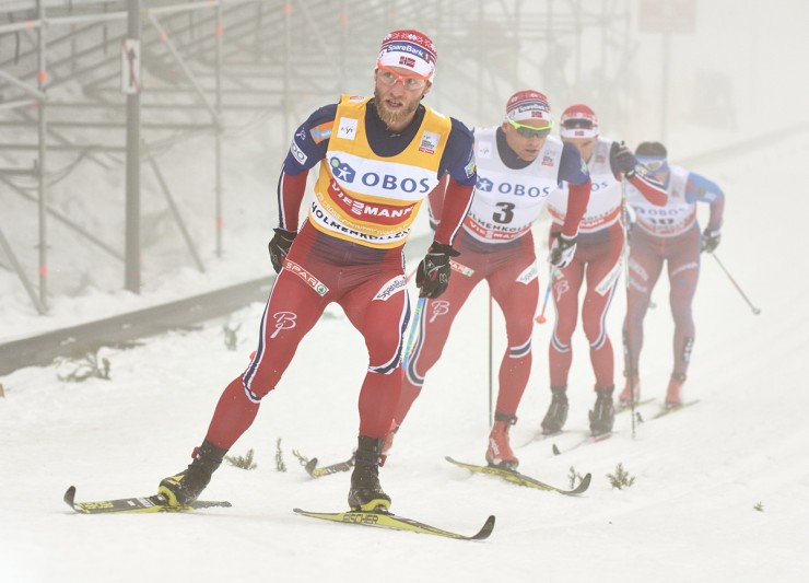 Norway's Martin Johnsrud Sundby leads teammates Niklas Dyrhaug (3), Didrik Tønseth, and Russia's Maxim Vylegzhanin (r) during the men's 50 k classic mass start at Holmenkollen in Oslo, Norway. (Photo: Fischer/NordicFocus)