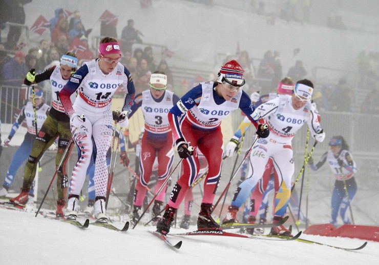 Early in the women's 30 k classic mass start, Sadie Bjornsen (14) in the mix with Norway's Ingvild Flugstad Østberg (3), Heidi Weng (front, in red), and Sweden's Charlotte Kalla (r) on Sunday at Holmenkollen in Oslo, Norway. (Photo: Fischer/NordicFocus)