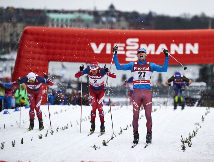Russia's Nikita Kriukov (27) celebrates his victory across the line during the men's classic sprint final at the World Cup in Stockholm, Sweden. Norway's Ola Vigen Hattestad (2) placed second and Petter Northug (l) was third. (Photo: Fischer/NordicFocus)