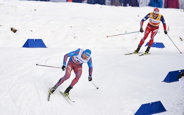 Russian Sergey Ustiugov leads Norway's Martin Johnsrud Sundby down a descent during the men's 15 k freestyle mass start on Sunday in Falun, Sweden. (Photo: Fischer/NordicFocus) 