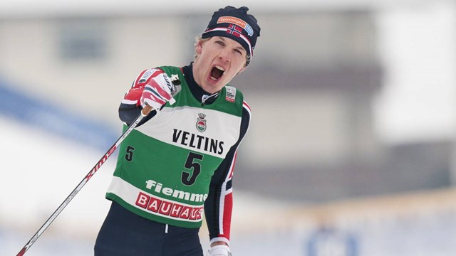 Norway's Magnus Krog celebrates across the line after winning the third day of the Nordic Combined World Cup in Val di Fiemme, Italy. (Credit: FIS/Nordic Focus)