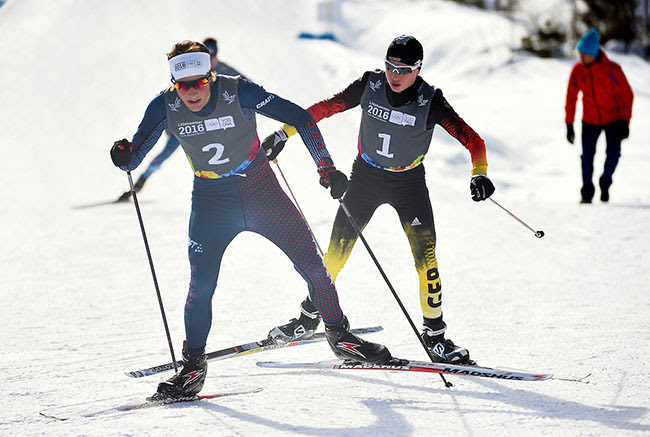 American Ben Loomis (2) leads Germany's Tim Kopp (1) during the Nordic Combined Men's Individual Gundersen NH/5 k cross-country race at Birkebeineren Cross-Country Stadium at the 2016 Youth Olympic Games in Lillehammer Norway. Loomis went on to place second behind Kopp. (Photo: Thomas Lovelock for YIS/IOC)