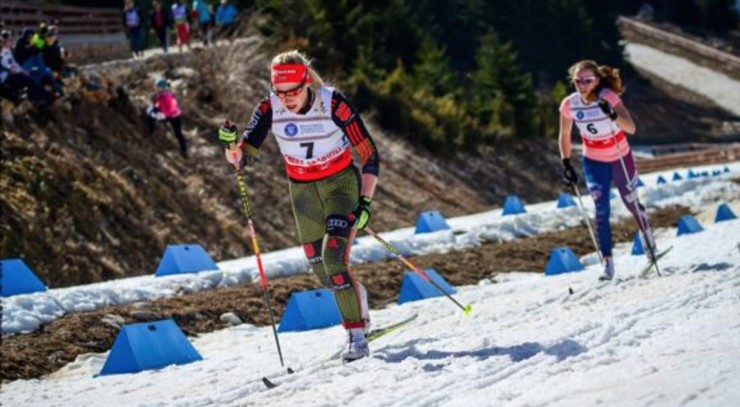 American Katharine Ogden (6), of the Stratton Mountain School and U.S. Ski Team, chases Germany’s Antonia Fraebel during the junior women’s 5 k classic at the Junior World Championships on Tuesday in Rasnov, Romania. (Photo: FIS Nordic JWSC & U23 WSC)