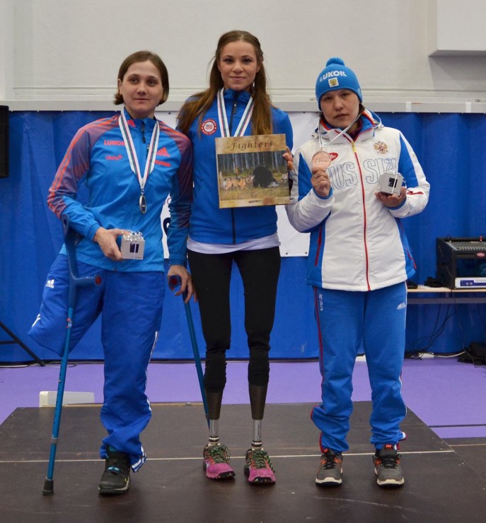 American Oksana Masters (c) on the podium with one of her three gold medals from this year's IPC World Cup Finals in Vuokatti, Finland. (Photo: IPC Nordic Skiing/Facebook)