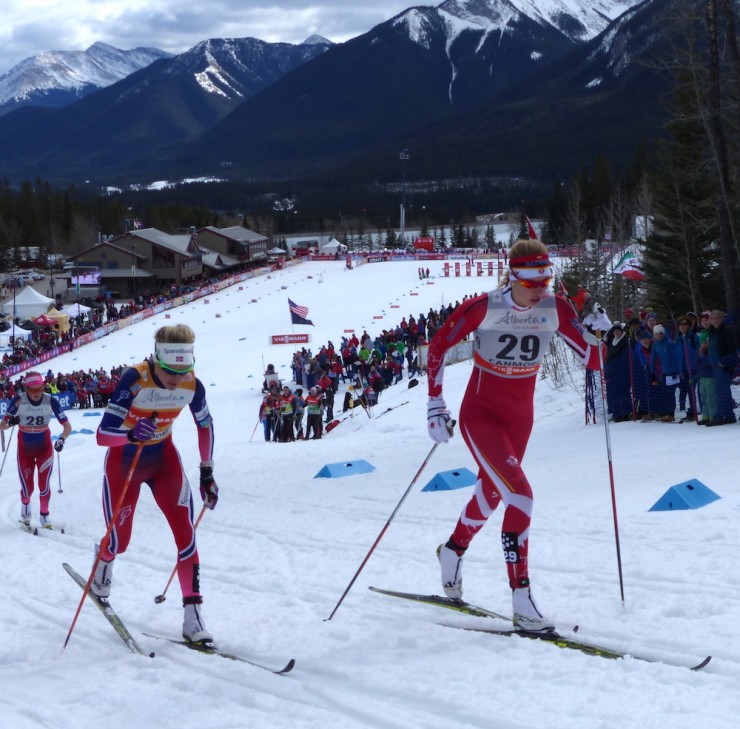 Canada's Daria Beatty (r) racing alongside overall World Cup leader Therese Johaug of Norway en route to a World Cup career best of 15th in Tuesday's classic sprint, Stage 5 of the Ski Tour Canada in Canmore, Alberta. (Photo: Peggy Hung)