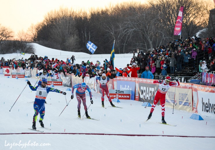 France's Baptiste Gros (l) stretches across the line to edge Canada's Alex Harvey (r) for the win in Stage 3 of the Ski Tour Canada, the men's 1.7 k freestyle sprint In Quebec City. Russia's Sergey Ustiugov (second from l) placed third after leading most of the race and Norway's Petter Northug (second from r) placed fourth. (Photo: John Lazenby/Lazenbyphoto.com)  