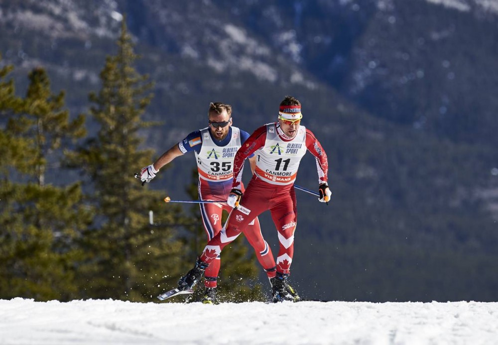 Canada's Ivan Babikov (11) skiing ahead of Norway's Petter Northug during the men's 15 k freestyle individual start at Stage 7 of the Ski Tour Canada in Canmore, Alberta. Northug placed eighth and Babikov finished 10th on the day. (Photo: Salomon/NordicFocus)