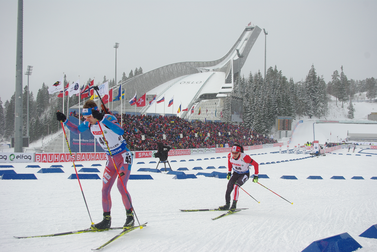 Nathan Smith of Canada chasing Anton Shipulin of Russia through the ranks; both had disappointing sprint races but moved  up considerably in the pursuit.