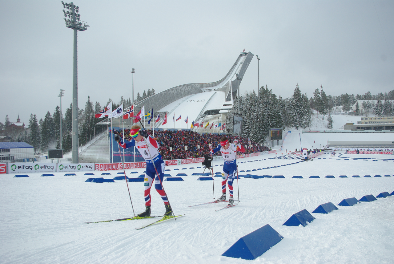 Johannes Thingnes Bø (bib 4) and Emil Hegle Svendsen of Norway setting up for a battle on the final loop of the pursuit.