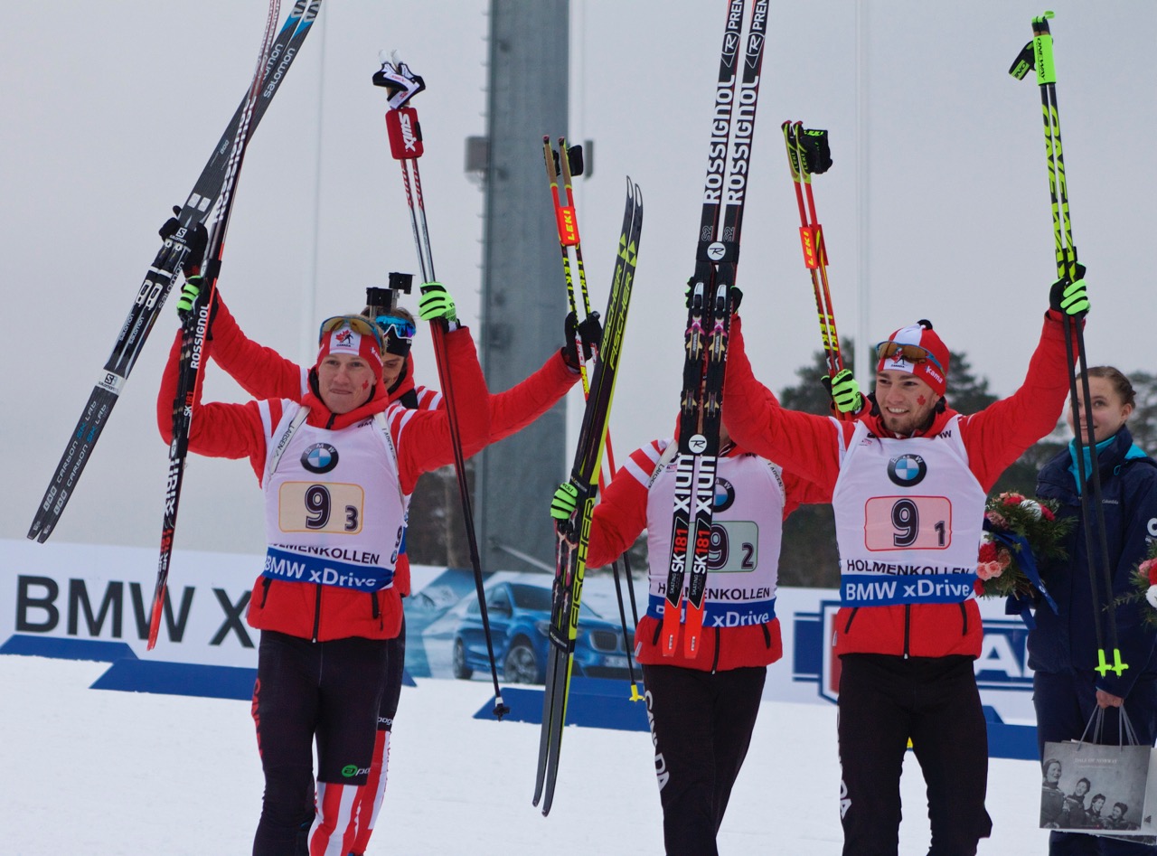 Gow (left) and the Canadian team celebrates their bronze medal before taking the podium for the men's relay. (Photo: JoJo Baldus)