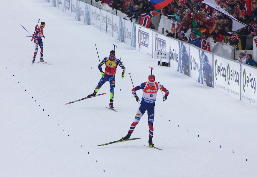 Norway's Johannes Thingnes Bø leads France's Martin Fourcade and Norway's Ole Einar Bjørndalen into the finish in the 15 k mass start in Oslo, Norway, at 2016 World Championships. (Photo: JoJo Baldus)