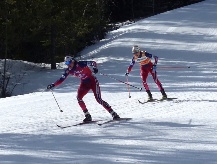 Norway's Heidi Weng leads teammate Therese Johaug as they descend back into the stadium to exchange skis for the women's 15 k skiathlon on Wednesday in Canmore Alberta. (Photo: Peggy Hung)