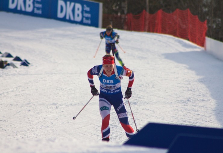 Norway's anchor Marte Olsbu racing to the win  in the IBU World Championships 4 x 6 k relay at home in Oslo, Norway, holding off France's Marie Dorin Habert (behind) by 5.3 seconds. (Photo: JoJo Baldus)