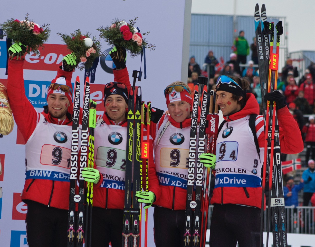 The Canadian men's team (l-r) Christian Gow, Nathan Smith, Scott Gow, and Brendan Green celebrate bronze in the men's 4 x 7.5 k relay at 2016 World Championships in Oslo, Norway. (Photo: JoJo Baldus)