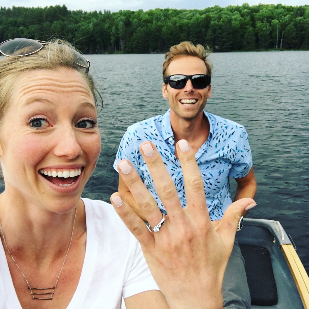 Erika Flowers (l) and Andy Newell flashing smiles on Friday July 1st, while out fishing on Gale Meadows Pond on the date of their engagement. (Courtesy Photo) 
