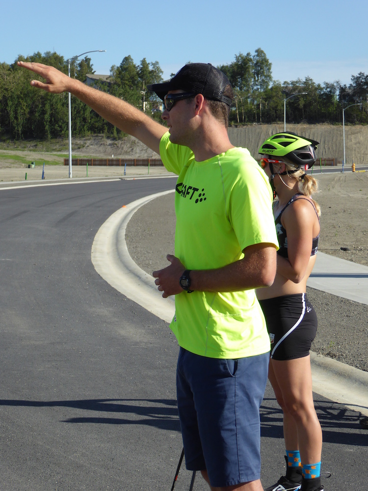 Matt Whitcomb (pointing) explaining the day's workout to a joint USST-APU training group, including U.S. Ski Team member Jessie Diggins (behind) on July 9 in Anchorage, Alaska.