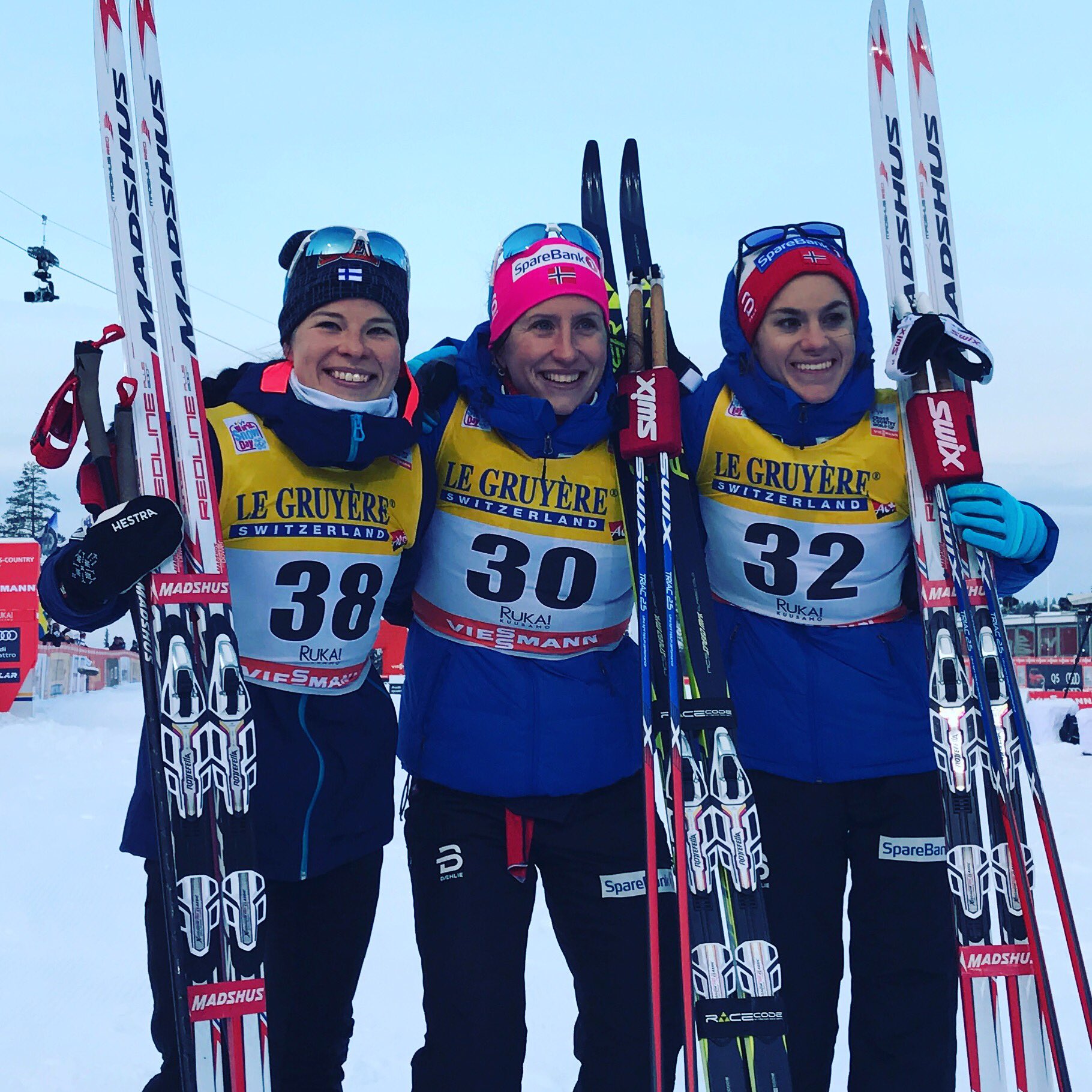 Marit Bjørgen of Norway (center) collected her first World Cup win of the season in the 10 k classic in Ruka, Finland, ahead of Finland's Krista Parmakoski (left) and Norway's Heidi Weng (right). (Photo: FIS Cross Country/Twitter)