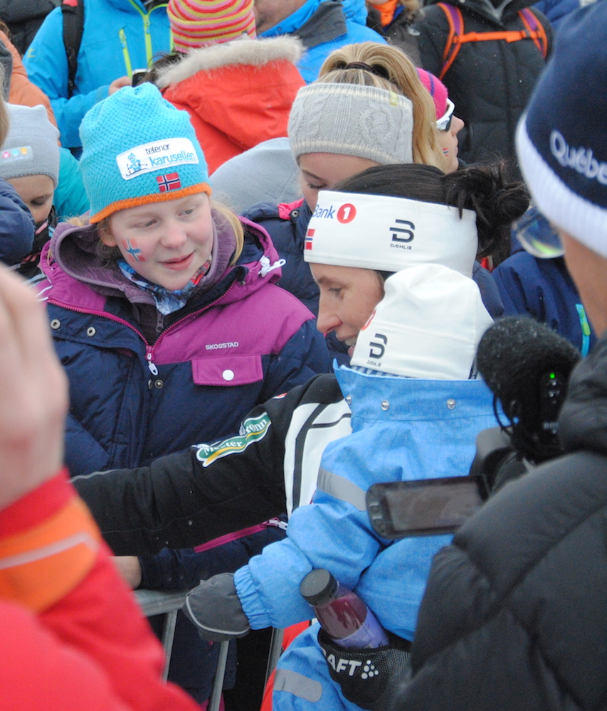 Norway's Marit Bjørgen with her baby, Marius, and fans in Beitostølen, Norway, following Bjørgen's first race since having a child in December 2015. Saturday marked Bjørgen's first race back since March 2015. (Photo: Aleks Tangen)